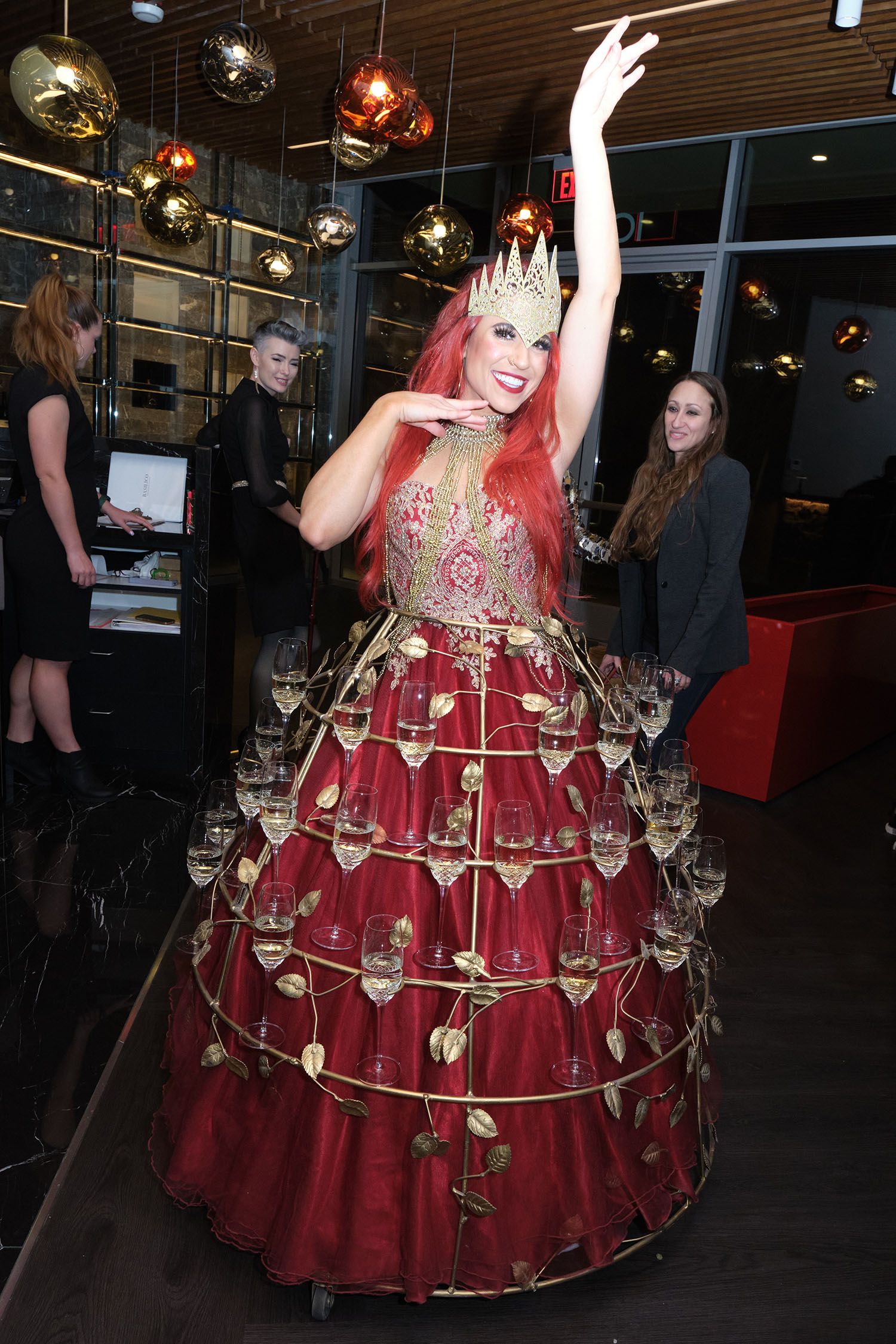Costumed las vegas woman wearing a red made from champagne flutes